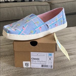 Toms Youth slip on. New in box. Never worn. Blue plaid with flamingos.